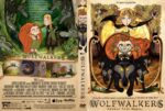 Cover art for Wolfwalkers: a girl in a red cloak and a boy in green stand in a forest among dark wolves, with the title Wolfwalkers beneath them.