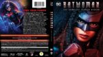 Front cover shows Batwoman in a black mask and blue-red suit with an intense gaze, city lights in the background; title Batwoman.