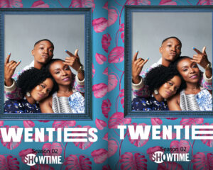 Two friends posing together for a Showtime poster, shown in front of blue ornate frames on teal wallpaper with pink leaves.