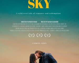 Poster for Bright Sky: a couple kissing at sunset with mountains in the distance and a teal-to-orange sky.