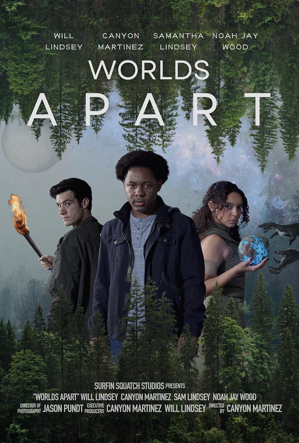 Movie poster for Worlds Apart showing three main characters in front of a forest backdrop with the title 'WORLDS APART' across the top.