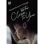 Poster for the film 'Close to You' showing a young person gazing out a window, with the title in script and a TIFF logo in the corner.