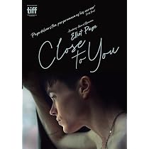 Poster for the film 'Close to You' showing a young person gazing out a window, with the title in script and a TIFF logo in the corner.