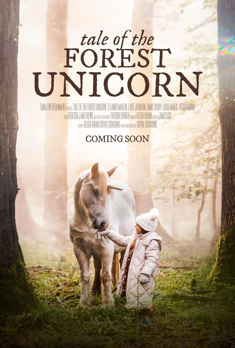 Poster for Tale of the Forest Unicorn: a child feeds a white unicorn in a sunlit forest; Coming Soon.