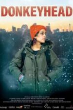 Poster for the film Donkeyhead, showing a woman in a green parka and orange beanie in a snowy cityscape background.