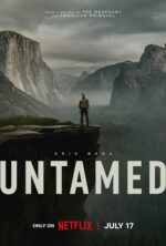 Man stands on a cliff edge overlooking a misty canyon with towering rock faces in a dramatic mountain landscape, movie poster for Untamed featuring Eric Bana.