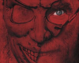 Close-up of a terrifying red-hued face with stitched grin and glasses, blue eye showing, poster for 'Your Host'.