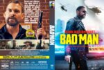 Front cover of Bad Man: Seann William Scott in sunglasses holding a pistol, neon yellow title 'BAD MAN' with helicopters in the background, urban setting.