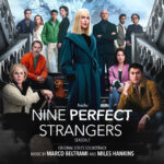 Poster for Hulu's Nine Perfect Strangers, Season 2, featuring a blonde woman in a teal coat center stage with the ensemble on stairs and a snowy mountain backdrop; title at bottom.