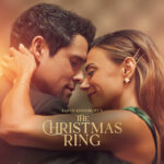 Close-up of a couple embracing on a warm, golden-lit movie poster for The Christmas Ring.
