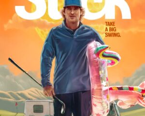 Apple TV+ poster featuring Owen Wilson with a large 'Stick' title, a man in a cap and polo holding a golf club and a colorful pool float near two RVs against an orange sky, showcasing the ad.