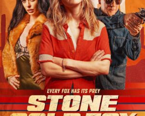 Movie poster for Stone Cold Fox with three lead characters posed against a warm orange background.