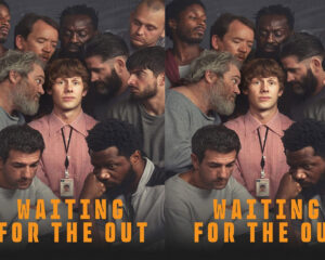 Poster showing a diverse group of men gathered closely around a young man in a pink shirt with a badge; bold orange text 'WAITING FOR THE OUT' appears at the bottom.