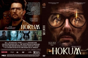 Double-sided Hokum DVD cover: front shows a bearded man with round glasses and intense eyes; warm, fiery lighting. Back features a collage of scenes and the film title Hokum.