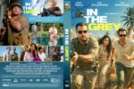 Movie poster for In the Grey: a group of four running through a sunlit, brushy landscape with a bold yellow title at top.